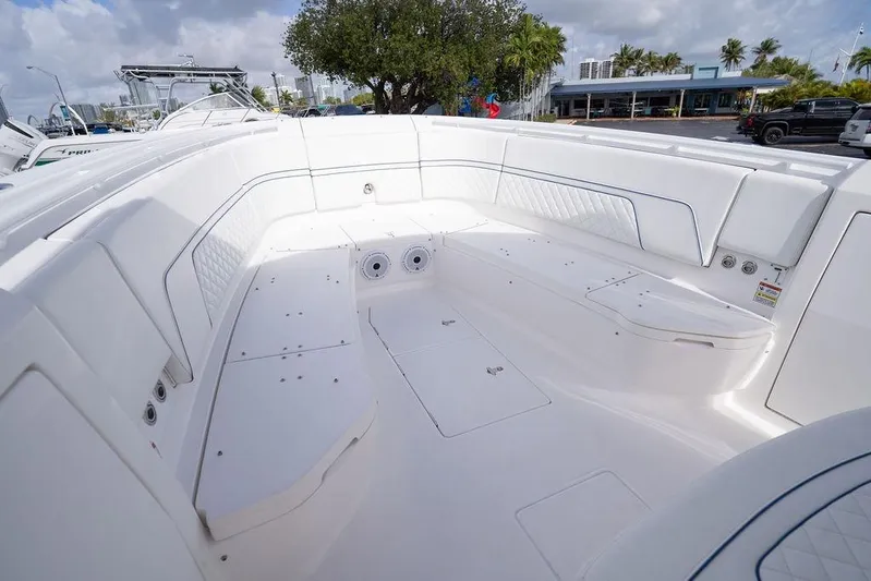  Yacht Photos Pics 2022 Intrepid 345 Nomad FE boat interior with spacious seating and sleek design.