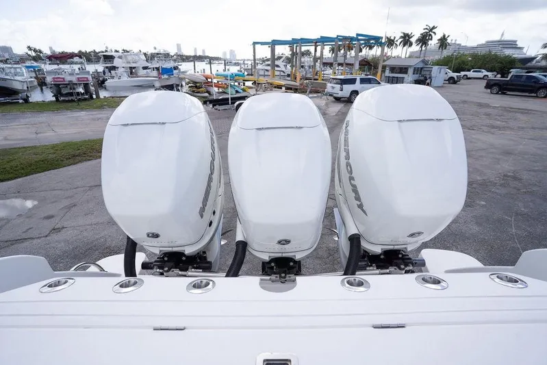  Yacht Photos Pics Triple Mercury outboard engines on a 2022 Intrepid 345 Nomad FE at a marina.