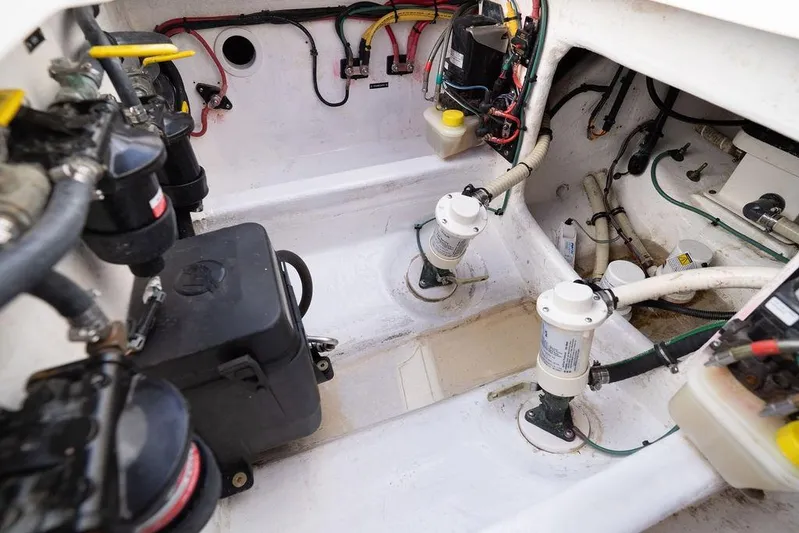  Yacht Photos Pics Engine compartment of 2022 Intrepid 345 Nomad FE boat, showcasing wiring and components.