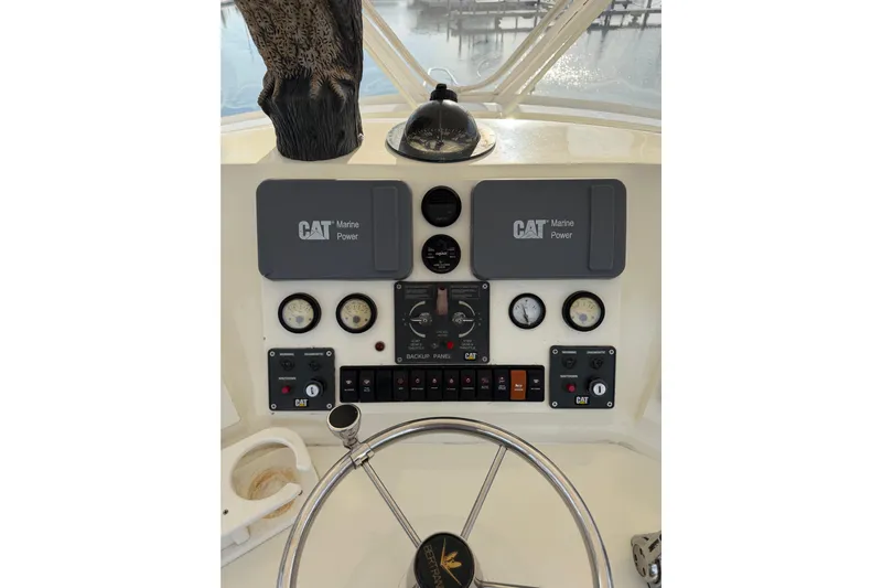 Unbelievable Yacht Photos Pics Control panel of a 1984 Bertram 42 Convertible boat with CAT Marine Power.