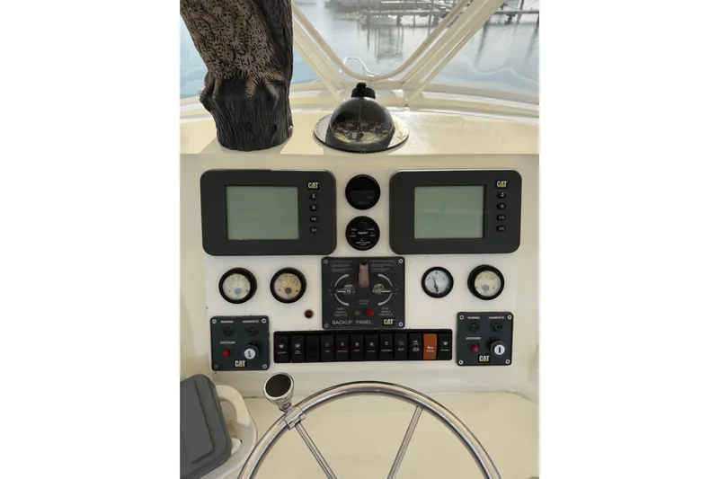 Unbelievable Yacht Photos Pics Control panel of a 1984 Bertram 42 Convertible boat with gauges and displays.