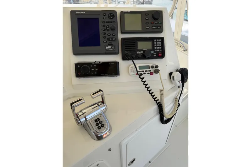 Unbelievable Yacht Photos Pics Control panel of a 1984 Bertram 42 Convertible boat with navigation and communication equipment.