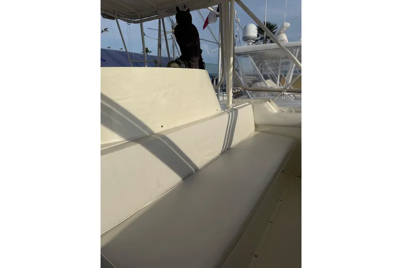 Unbelievable Yacht Photos Pics 1984 Bertram 42 Convertible boat interior with seating and canopy.