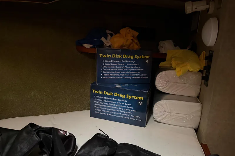 Unbelievable Yacht Photos Pics Storage area in a 1984 Bertram 42 Convertible with Twin Disk Drag System boxes.