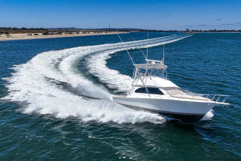Catch Ya Later Yacht Photos Pics 2009 Egg Harbor 37 SportYacht cruising on open water, leaving a dynamic wake.