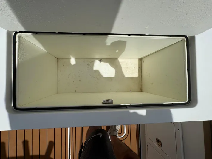  Yacht Photos Pics Open storage compartment on 2019 World Cat 3200 boat, viewed from above.