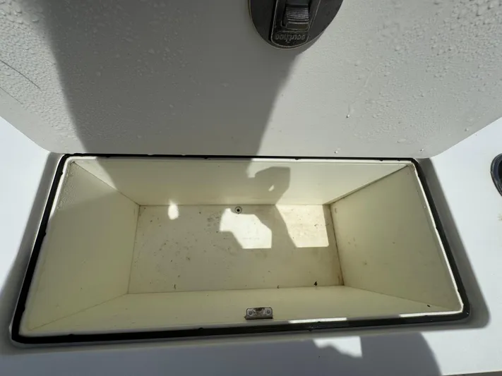  Yacht Photos Pics Open storage compartment on 2019 World Cat 3200 boat, showing interior space.