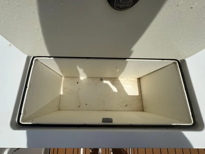  Yacht Photos Pics Open storage compartment on 2019 World Cat 3200 boat, showing interior space.