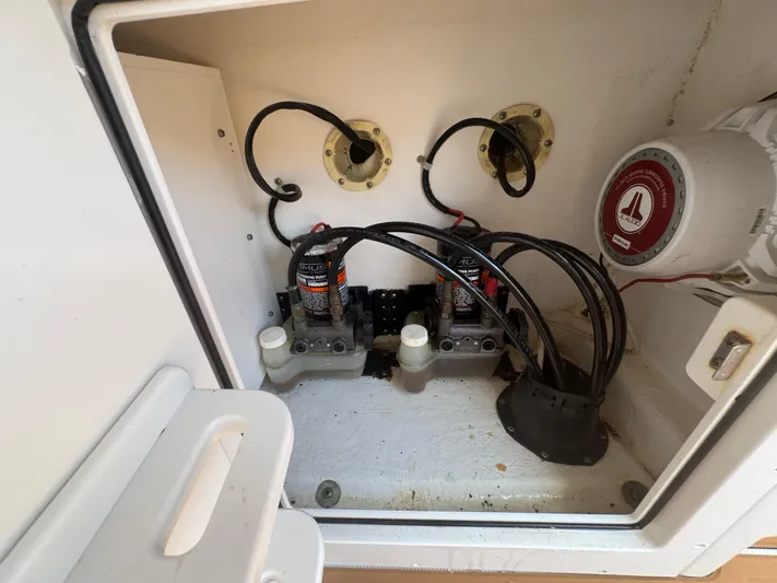  Yacht Photos Pics 2019 World Cat 3200 boat compartment with wiring and marine equipment.