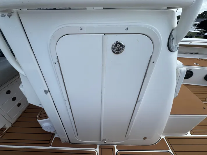  Yacht Photos Pics 2019 World Cat 3200 boat storage compartment with teak flooring.