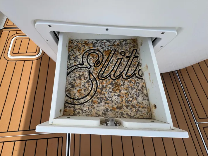  Yacht Photos Pics Open storage compartment on 2019 World Cat 3200 boat with "Elite" text inside.