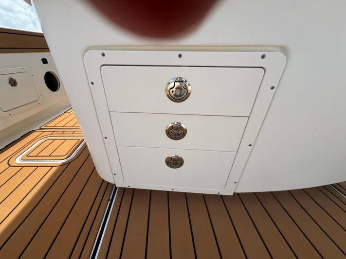  Yacht Photos Pics 2019 World Cat 3200 boat storage drawers on teak deck.