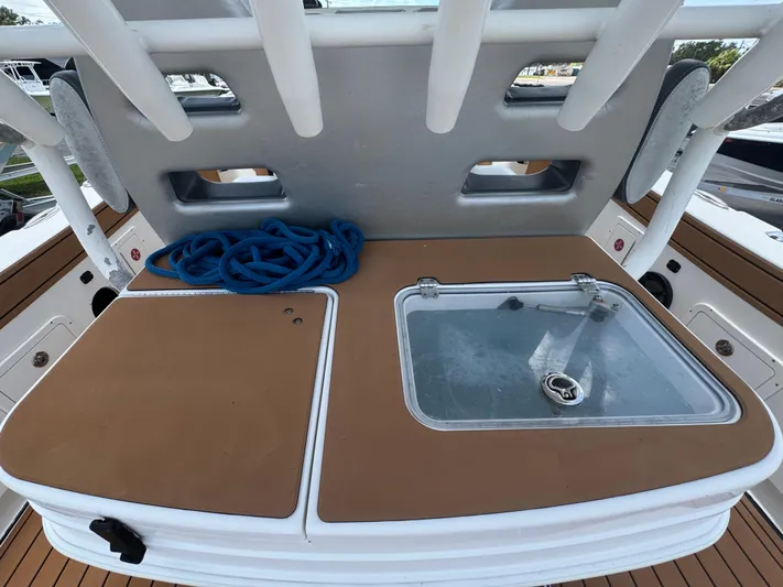  Yacht Photos Pics 2019 World Cat 3200 boat deck with storage and blue rope.
