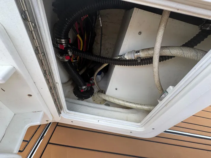  Yacht Photos Pics 2019 World Cat 3200 boat compartment with hoses and wiring.