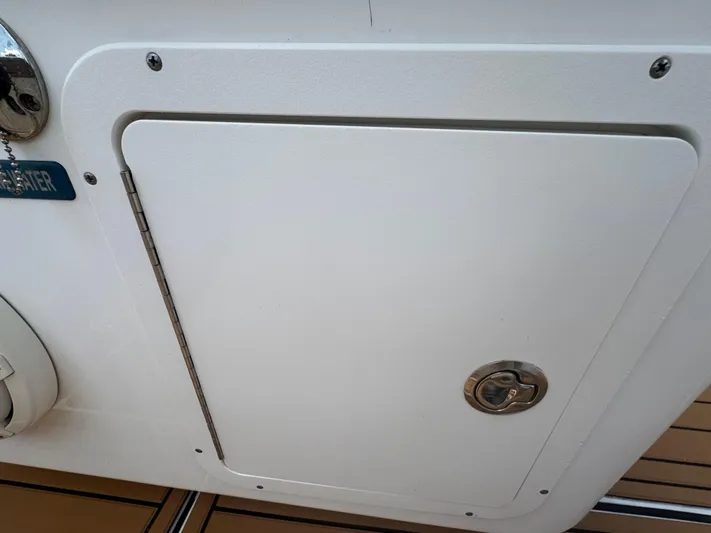  Yacht Photos Pics Hatch door on a 2019 World Cat 3200 boat, featuring a secure latch.