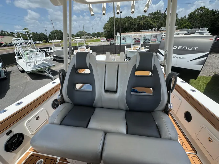  Yacht Photos Pics 2019 World Cat 3200 boat interior with dual seats and rod holders.