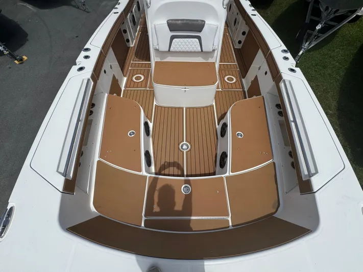  Yacht Photos Pics 2019 World Cat 3200 boat interior with brown and white seating and deck.