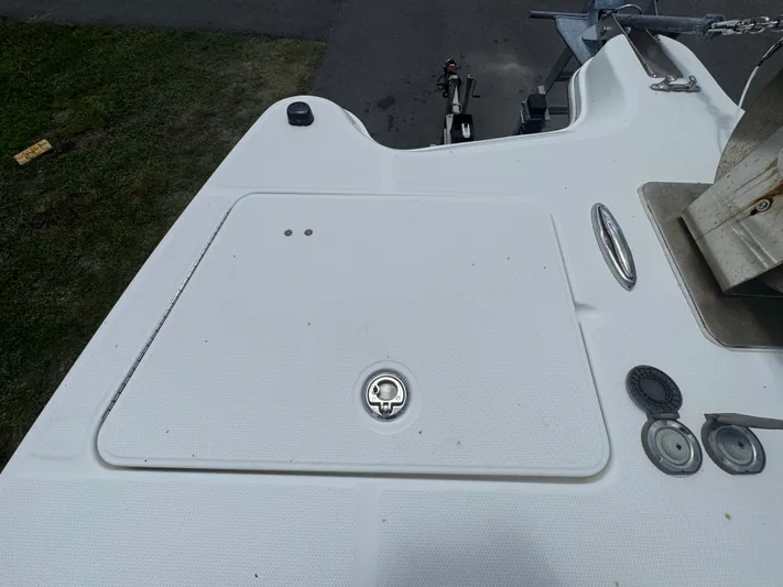  Yacht Photos Pics 2019 World Cat 3200 boat deck with storage hatch and fittings.