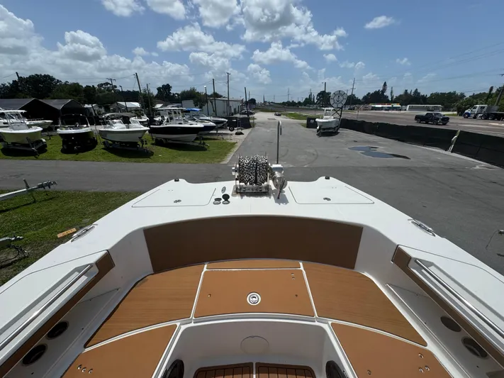  Yacht Photos Pics 2019 World Cat 3200 boat on display at a marina under a cloudy sky.