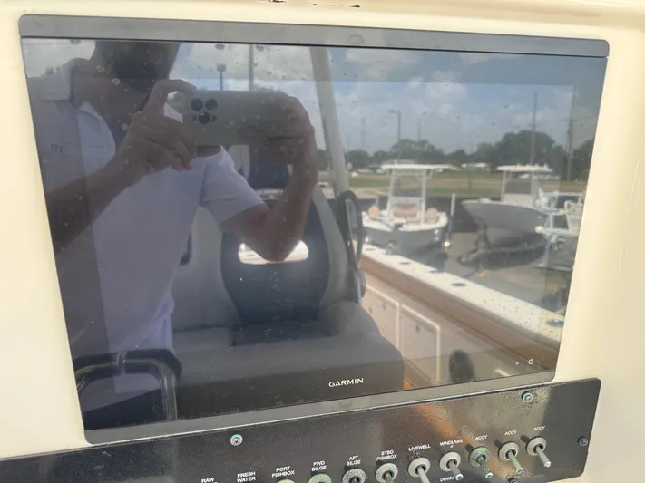  Yacht Photos Pics Control panel of a 2019 World Cat 3200 boat with Garmin display.