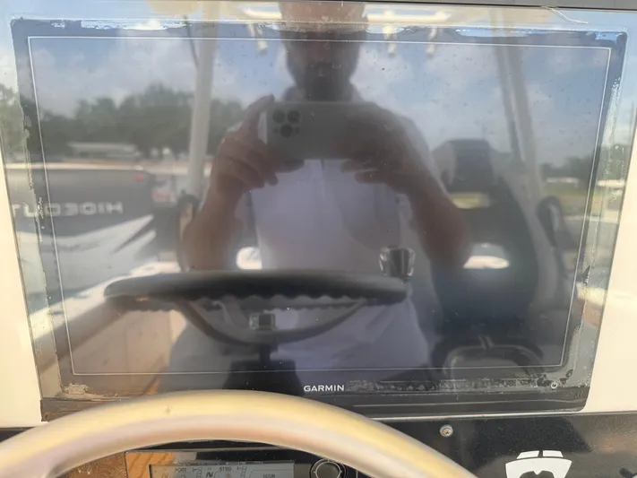  Yacht Photos Pics Reflection on Garmin screen in 2019 World Cat 3200 boat cockpit.