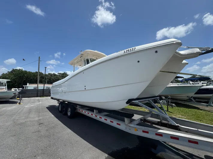  Yacht Photos Pics 2019 World Cat 3200 boat on trailer under clear blue sky.