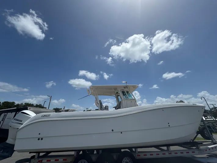  Yacht Photos Pics 2019 World Cat 3200 boat on trailer under clear blue sky.