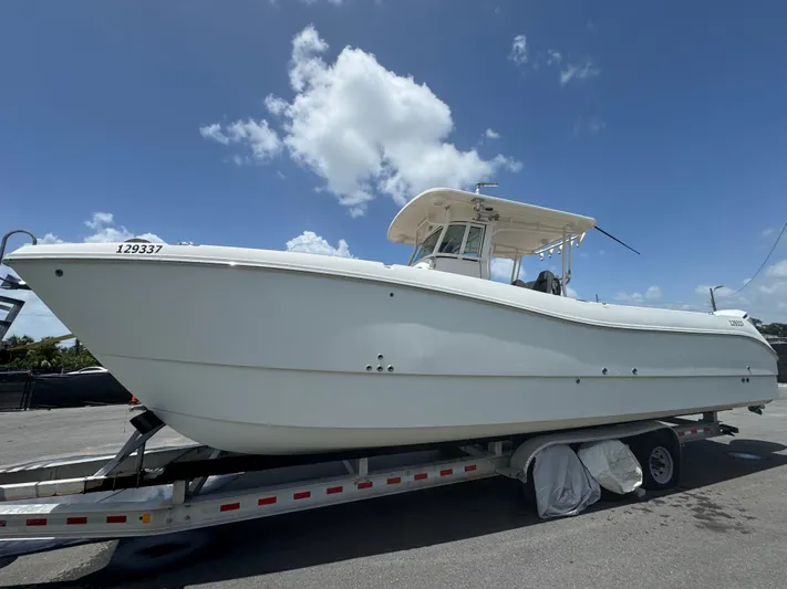  Yacht Photos Pics 2019 World Cat 3200 boat on trailer under clear blue sky.