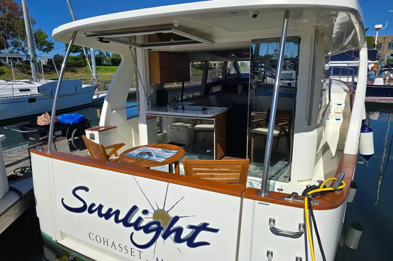  Yacht Photos Pics 2020 Greenline 40 yacht named "Sunlight" docked, featuring a spacious outdoor seating area.