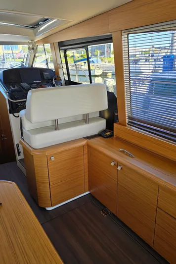  Yacht Photos Pics Interior of a 2020 Greenline 40 yacht with modern wood finish and helm station.