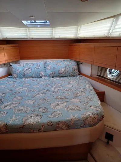  Yacht Photos Pics Cozy bedroom in 2020 Greenline 40 yacht with nautical-themed bedding.