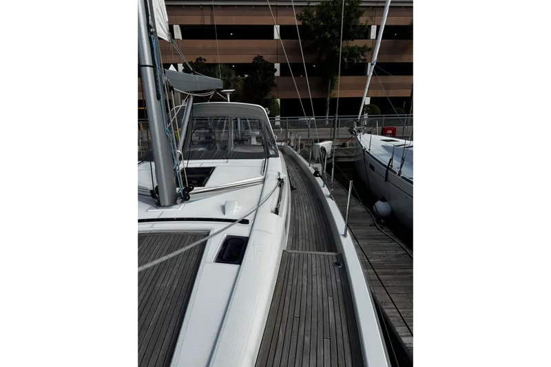 Sea Dawgs Yacht Photos Pics 2021 Beneteau Oceanis Yacht 54 docked, showcasing sleek deck design and modern features.