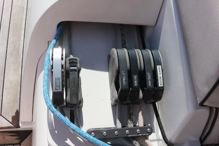 Sea Dawgs Yacht Photos Pics Control panel on 2021 Beneteau Oceanis Yacht 54, featuring labeled winches and ropes.