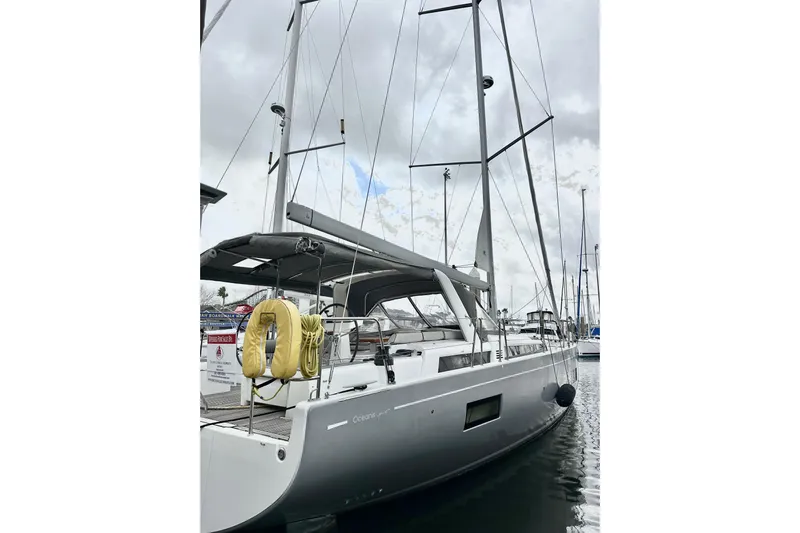 Sea Dawgs Yacht Photos Pics 2021 Beneteau Oceanis Yacht 54 docked, showcasing sleek design and modern features.