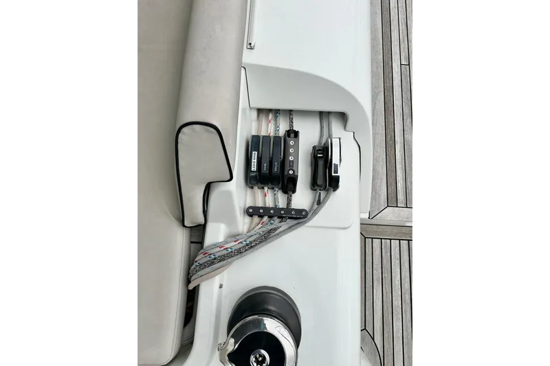 Sea Dawgs Yacht Photos Pics Beneteau Oceanis Yacht 54 deck detail, showcasing winch and rope system, 2021 model.