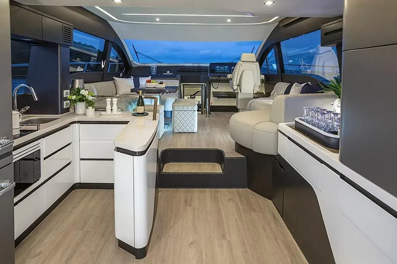  Yacht Photos Pics Manufacturer Provided Image: Luxurious interior of 2025 Schaefer 600 yacht with modern kitchen and seating area.