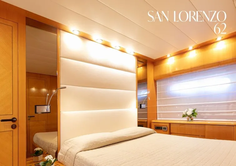  Yacht Photos Pics Luxurious bedroom interior of 1998 Sanlorenzo SL62 yacht with elegant lighting and modern design.
