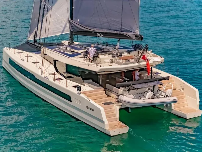 Jack Yacht Photos Pics 2023 McConaghy MC75 catamaran sailing on turquoise waters.