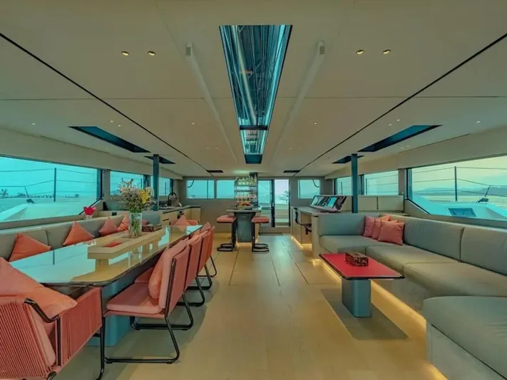 Jack Yacht Photos Pics Luxurious interior of 2023 McConaghy MC75 yacht with modern seating and panoramic windows.