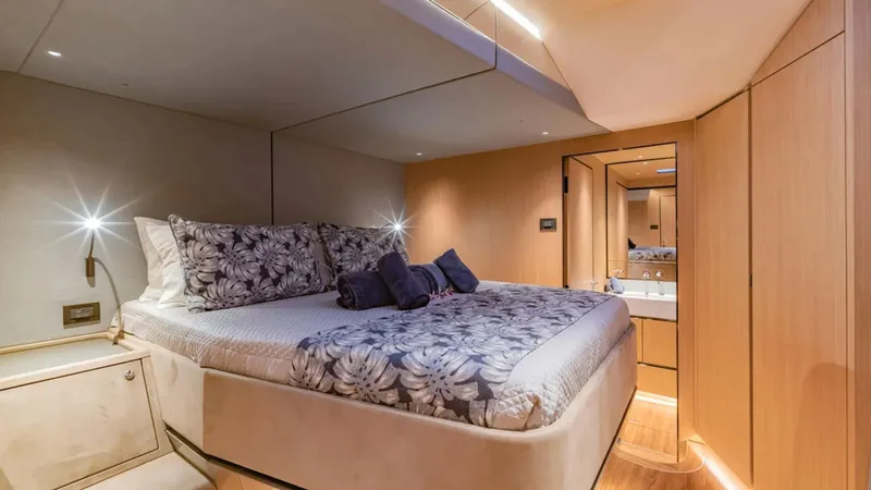 Jack Yacht Photos Pics Luxurious 2023 McConaghy MC75 yacht bedroom with elegant bedding and modern lighting.