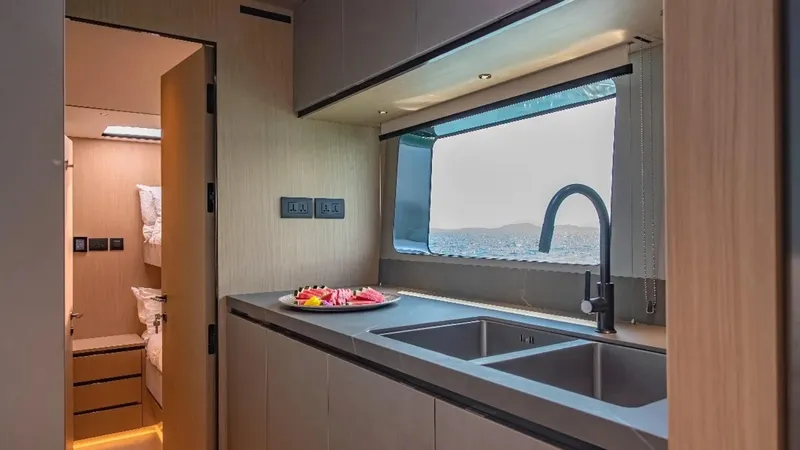 Jack Yacht Photos Pics Modern kitchen interior of 2023 McConaghy MC75 yacht with sleek design and ocean view.