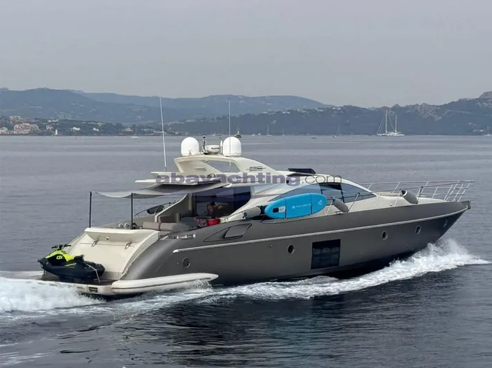  Yacht Photos Pics 2004 Azimut 68S yacht cruising on calm waters with scenic mountain backdrop.
