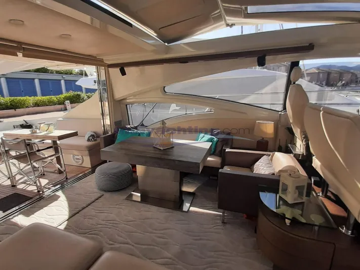  Yacht Photos Pics Luxurious interior of 2004 Azimut 68S yacht with modern furnishings and ample natural light.