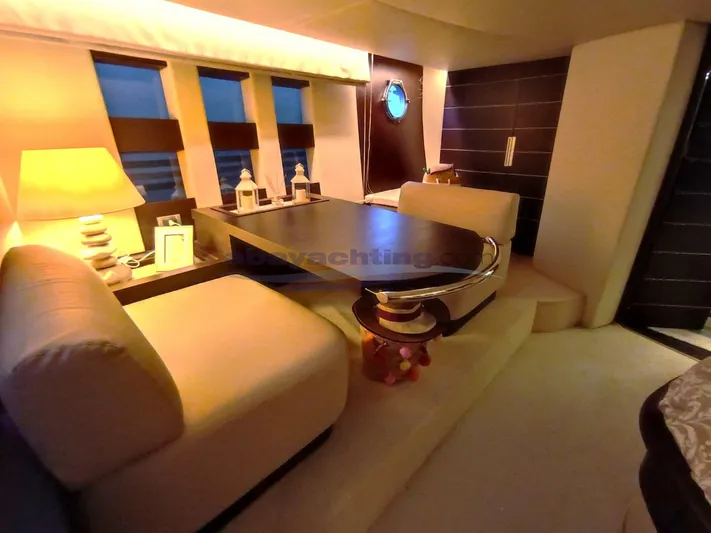  Yacht Photos Pics Luxurious interior of 2004 Azimut 68S yacht with elegant seating and ambient lighting.