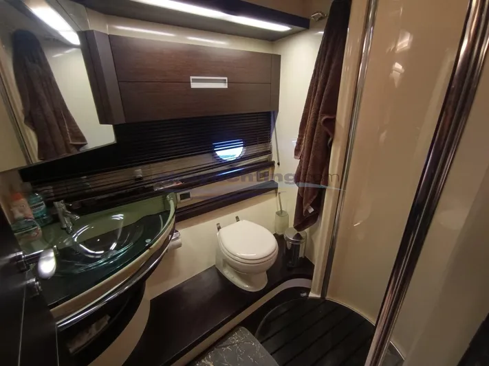  Yacht Photos Pics Luxurious bathroom in 2004 Azimut 68S yacht with modern fixtures and elegant design.