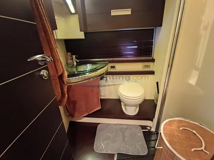  Yacht Photos Pics Luxurious bathroom in 2004 Azimut 68S yacht with modern fixtures and elegant design.