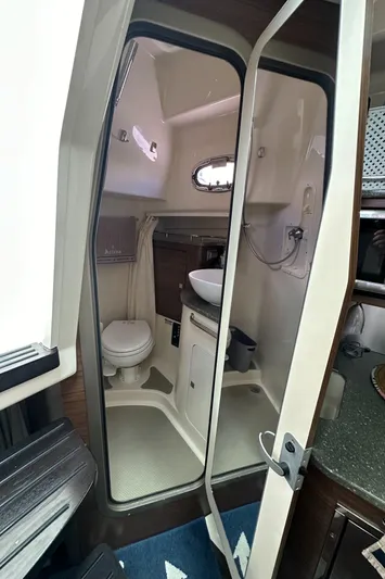  Yacht Photos Pics 2015 Boston Whaler 345 Conquest bathroom interior with toilet, sink, and shower.