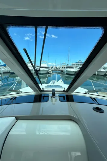  Yacht Photos Pics 2015 Boston Whaler 345 Conquest view from helm, overlooking marina with boats.