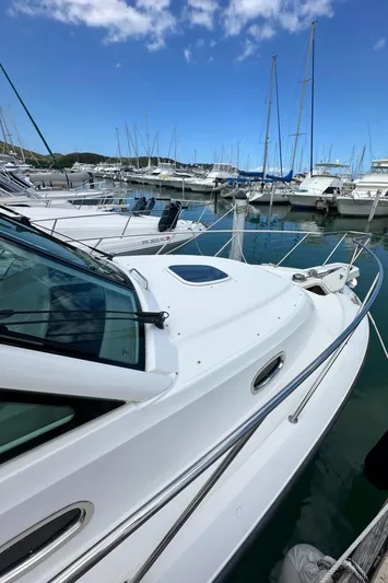  Yacht Photos Pics 2015 Boston Whaler 345 Conquest docked in a marina with other boats.