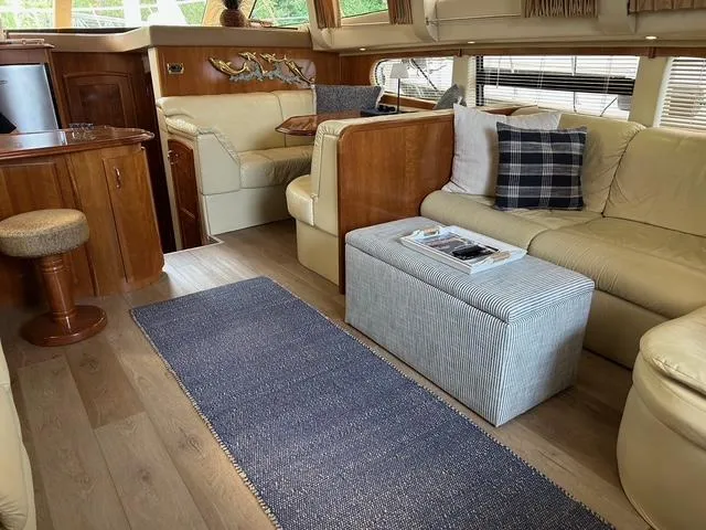 River Dancer Yacht Photos Pics Luxurious interior of 2004 Carver 466 Motor Yacht with elegant seating and decor.